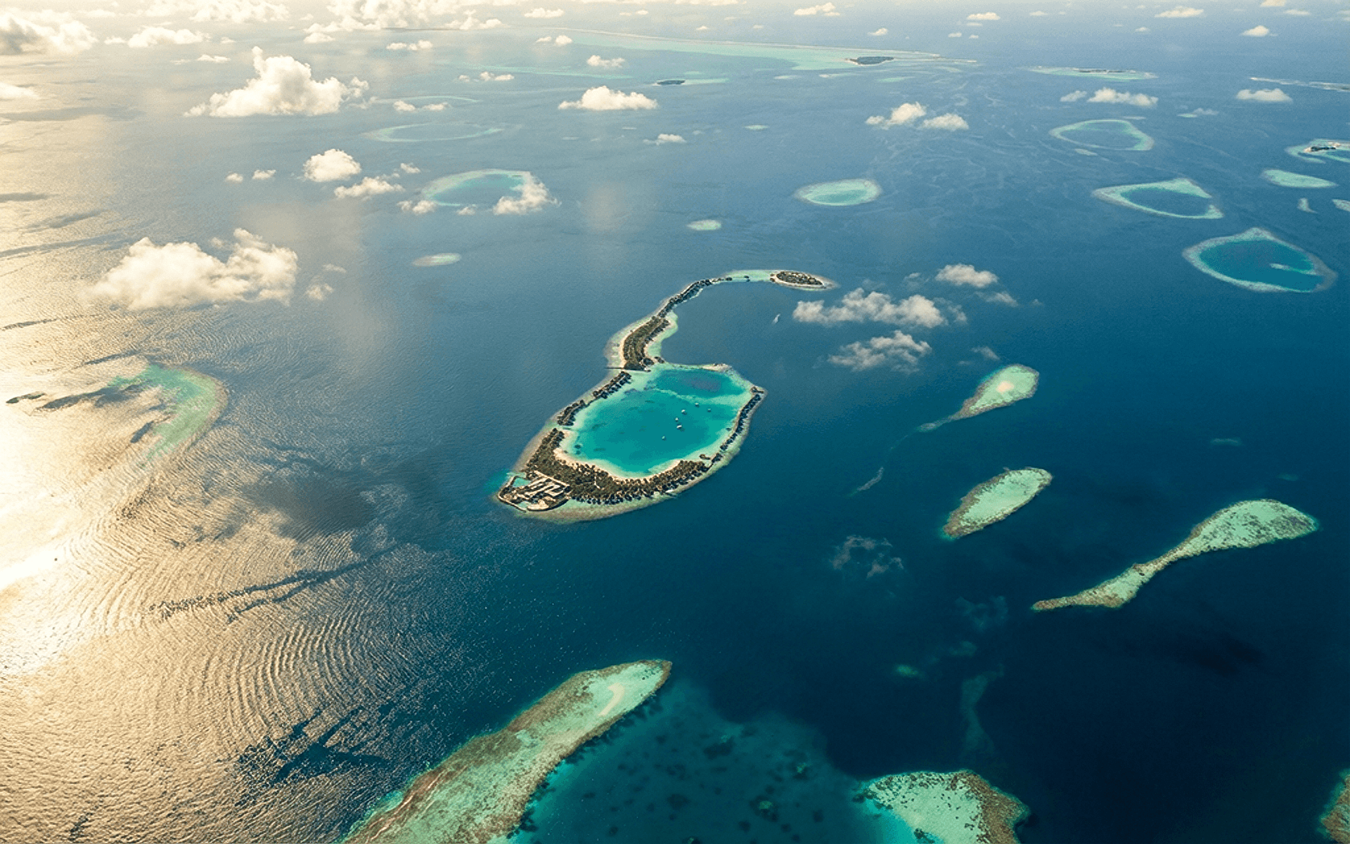 Luxury overwater villas in the Maldives surrounded by turquoise waters